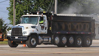 Permco dump truck at work using hydraulic dump pumps