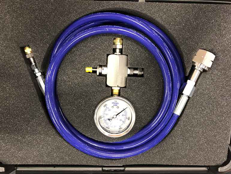 How do you safely precharge an accumulator?