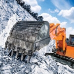 The new EX2000-7 mining excavator from Hitachi features electronic regulation of hydraulic pumps, high-efficiency regeneration, heavy-duty guards for hoses and accumulators, and contamination sensors on pumps and motors.